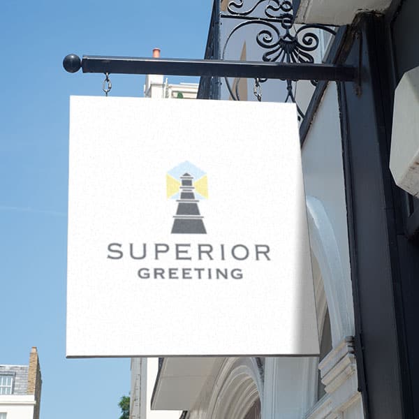 a sign hanging from a building with the inscription of "Superior Greeting" on it.